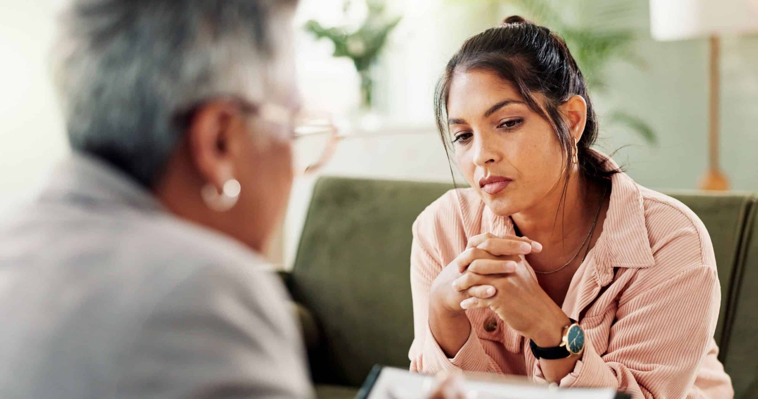 A woman talks to her therapist about women's meth addiction treatment​.