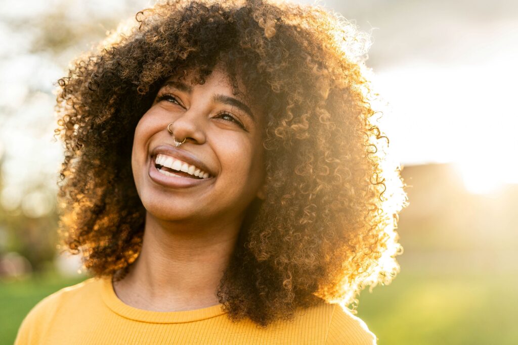 Woman smiling after attending a private pay drug rehab.